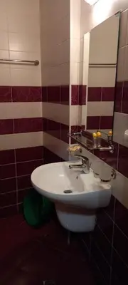 a bathroom with a white sink and a mirror at Ski Place in Pamporovo