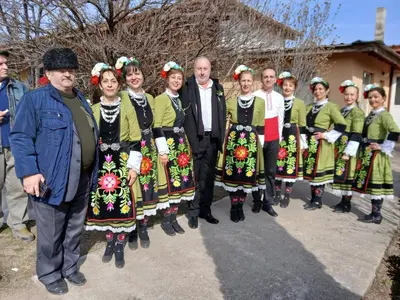 a group of people in traditional dress posing for a picture at Винарна-Славовица in Kalugerovo