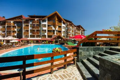 a hotel with a swimming pool and a resort at Belvedere luxury apartment in Bansko