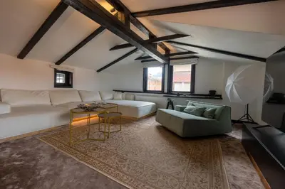 a living room with a couch and a table at Bashtin Dom - Skabrin House in Bansko