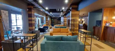 a room with couches and chairs in a store at Borovets Forest view (A56) in Borovets