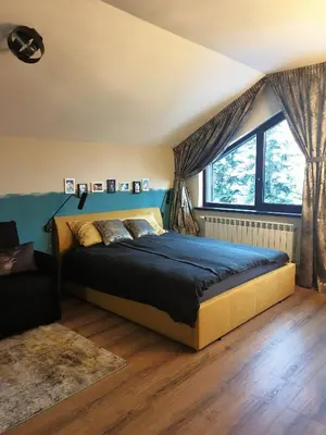 a bedroom with a bed and a large window at Borovets Forest view (A56) in Borovets
