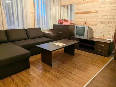 a living room with a couch and a tv at Bansko Royal Towers - Studio 815 in Bansko