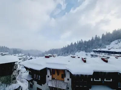 a group of houses covered in snow at Гранд Манастира Пампорово, Двустаен апартамент Deluxe in Pamporovo