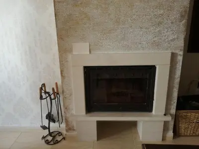 a fireplace in a living room with a white mantle at Гранд Манастира Пампорово, Двустаен апартамент Deluxe in Pamporovo