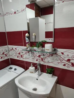 a bathroom with a sink and a mirror at Bansko Dream Apartment City Center in Bansko