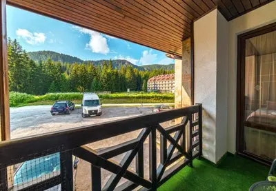 a balcony with a view of a parking lot at Forest Home 524 in Smolyan