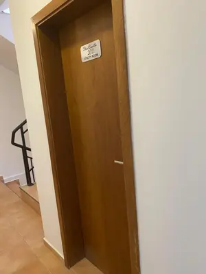 a wooden door with a sign on it at Ski Area 202 apt, The Castle 1, Pamporovo in Pamporovo