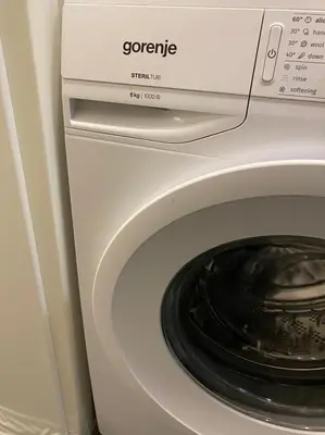 a white washer and dryer in a room at Уютен апартамент на 3 мин. от главната и Капана +паркинг in Plovdiv