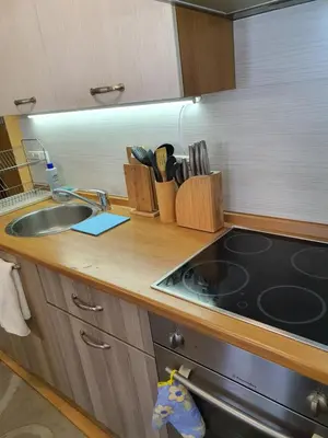 a kitchen with a sink and a counter top at Koko's apartments 2 in Bansko