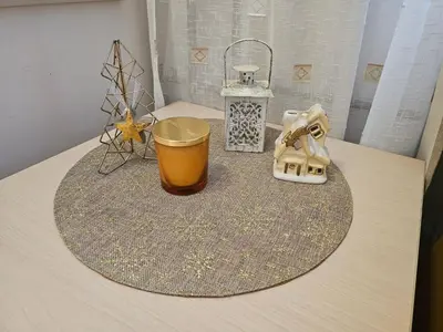 a table with a cup and other items on it at Apartment Kristin in Apart Hotel Stenata in Pamporovo