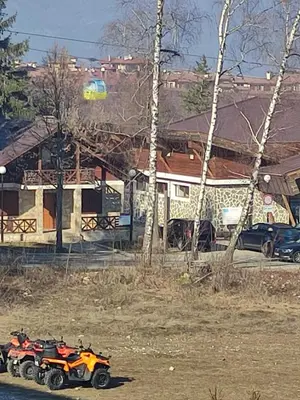 a couple of motorcycles parked on the side of the road at Cedar 42 in Bansko