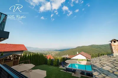 a view from the balcony of a villa with a swimming pool at Вила Рустик / Villa Rustic in Kyustendil