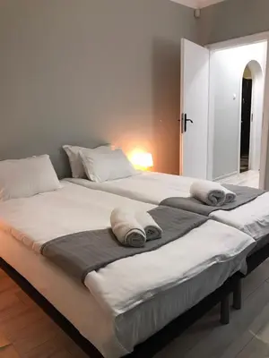 a large bed with towels on top of it at EU metro station, City Center, lovely 3-bedroom apartment, free parking in Sofia