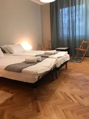a bedroom with two beds with towels on them at EU metro station, City Center, lovely 3-bedroom apartment, free parking in Sofia