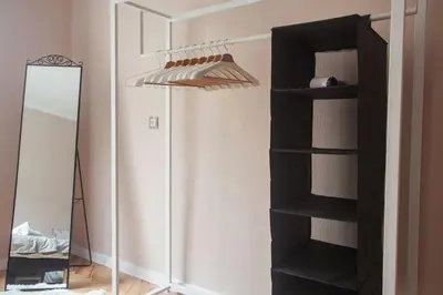 a black book shelf in a room with a mirror at Sofia center, Shishman street bijou in Sofia