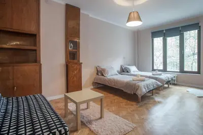 a living room with a couch and a table at Sofia center, Shishman street bijou in Sofia