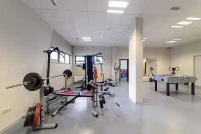a gym with several exercise bikes in a room at 4 Seasons Apartment 535, Oak Residence in Smolyan