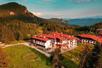 an aerial view of a large house in the mountains at 4 Seasons Apartment 535, Oak Residence in Smolyan