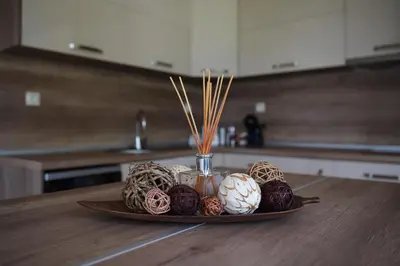 a plate of eggs on a table in a kitchen at Вила Релакс in Pamporovo