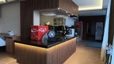 a kitchen with a red appliance on a counter at Kamena Pamporovo in Pamporovo