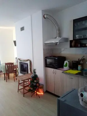 a kitchen with a christmas tree on the counter at Синьо небе in Bansko