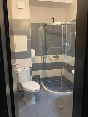 a bathroom with a toilet and a shower at Lovely Аpartment in IGLIKA 2,Borovets in Borovets