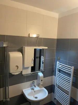 a bathroom with a sink and a mirror at Lovely Аpartment in IGLIKA 2,Borovets in Borovets