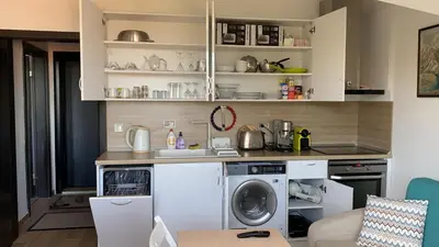 a kitchen with a washer and a washing machine at Lovely Аpartment in IGLIKA 2,Borovets in Borovets