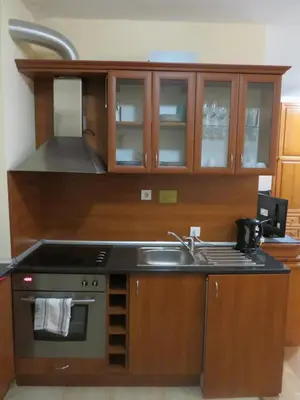 a kitchen with a sink and a stove at Flora Violet Studio Apartment nr 10 in Borovets
