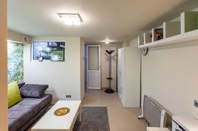 a living room with a couch and a table at Top Center Vintage Sofia Condo in Sofia