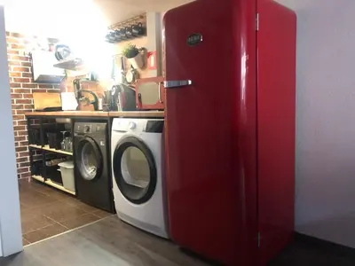 a red refrigerator in a kitchen with a washing machine at Top Center Vintage Sofia Condo in Sofia