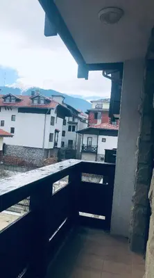 a balcony with a view of a city with buildings at Marina Apartments - One Bedroom in Bansko