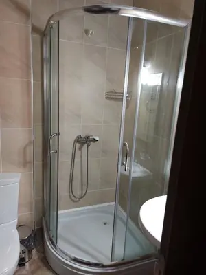 a shower with a glass door in a bathroom at Studio GERONIMO in Pamporovo