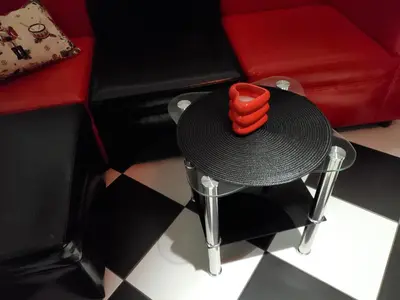 a black table with a red candle on top of it at Романтично Място Ани in Plovdiv