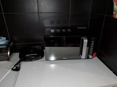 a microwave oven sitting on top of a counter at Романтично Място Ани in Plovdiv
