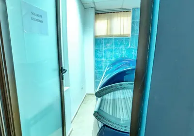 a glass door with a reflection of a car in a room at Belvedere Holiday Club К501 in Bansko