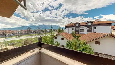 a view from the balcony of a house with mountains at Hotel FAMIL - adults only in Bansko