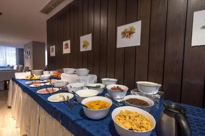 a long table with bowls of food on it at Dinos 2 Bed Cozy Apart at Bansko close to the lift in Bansko