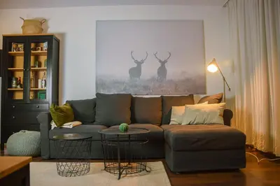 a living room with a couch and two tables at Dinos 2 Bed Cozy Apart at Bansko close to the lift in Bansko