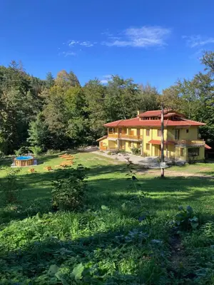 a large house in the middle of a field at Вила Ренесанс Костенец in Kostenets Village