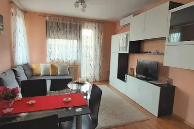 a living room with a couch and a table at Mia's Apartment, Stylish one-bedroom apartment in Sofia