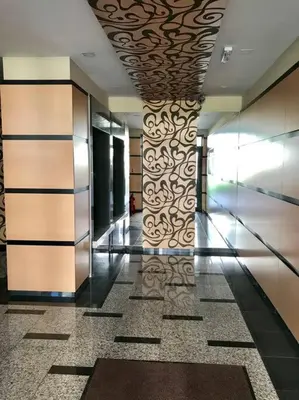 a hallway in a building with a wall of glass at Mia's Apartment, Stylish one-bedroom apartment in Sofia