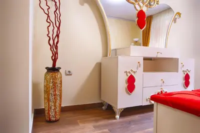 a childs room with a vase next to a dresser at Айляк Клуб Велинград - Бутиков Хотел&СПА с Elegant Ultra All Inclusive in Velingrad