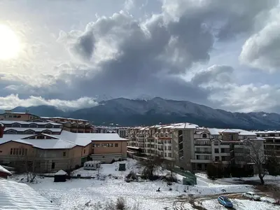 a city with snow on the ground and buildings at CEDAR LODGE NEXT TO LIFT ONE BEDROOM APARTMENT in Bansko