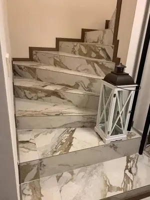 a marble stairway with a lantern on it at Casa Veneta in Oreshak