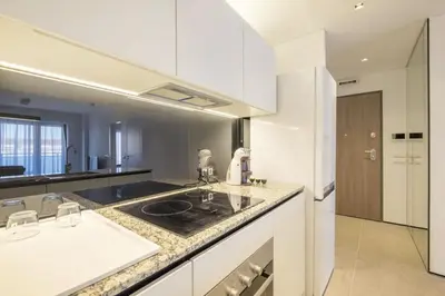 a kitchen with a sink and a counter top at City Apartments - Mall of Sofia & Metro Station in Sofia