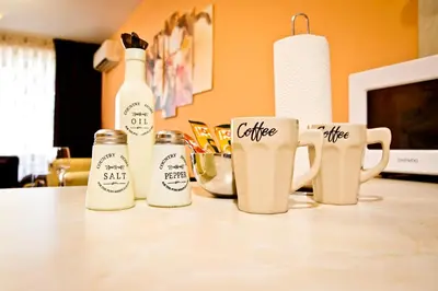 a group of coffee mugs sitting on a table at Sunflower Apartment City Center in Plovdiv