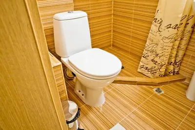 a bathroom with a toilet in a small room at Sunflower Apartment City Center in Plovdiv