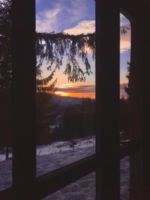 a view of a sunset through a window at Villa Mischa in Grashtitsa